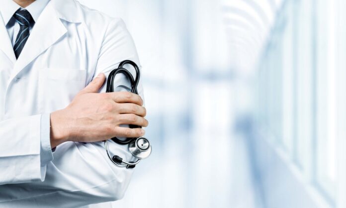 Doctor_Holding_Stethoscope_1200x